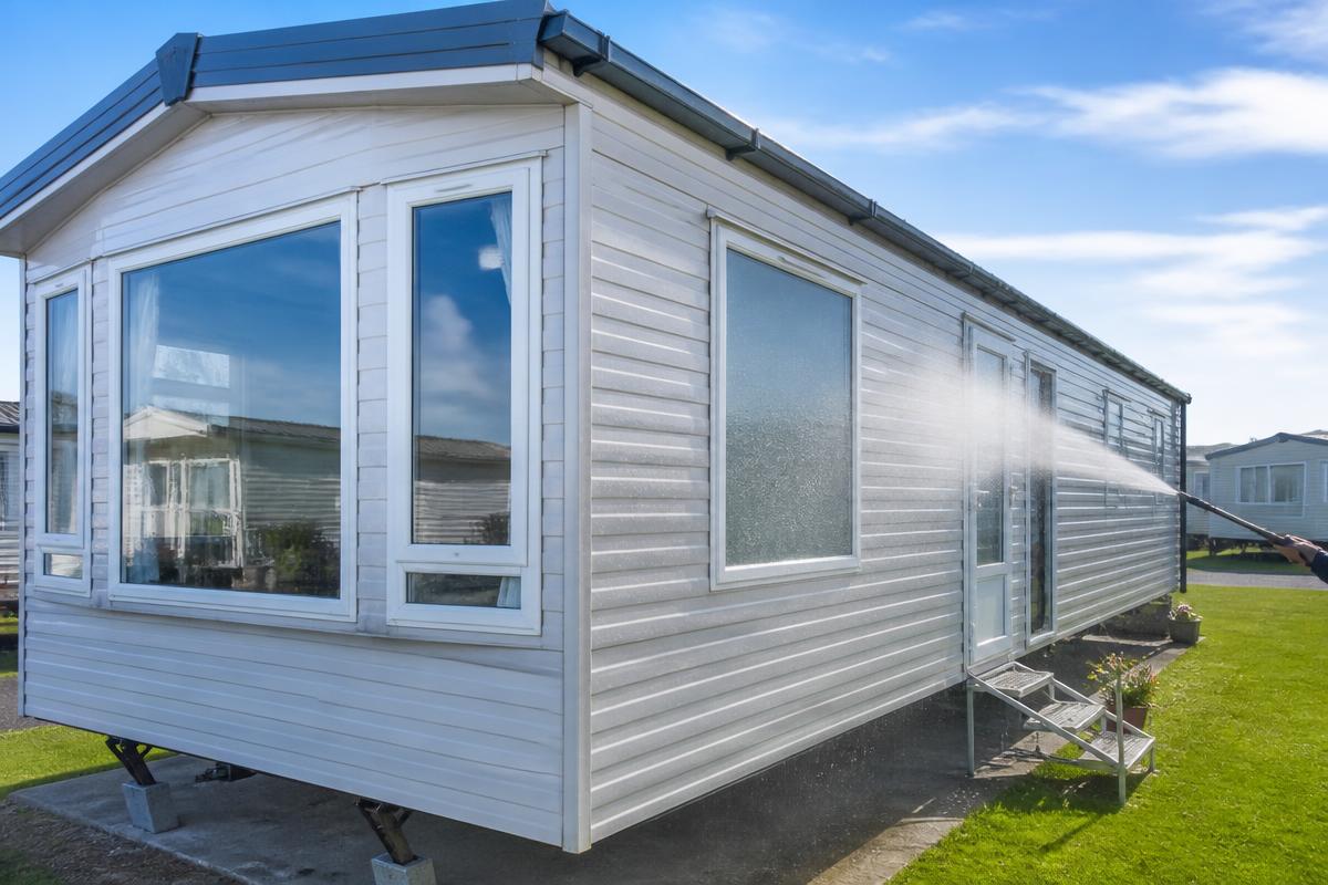 Static caravan exterior being professionally cleaned